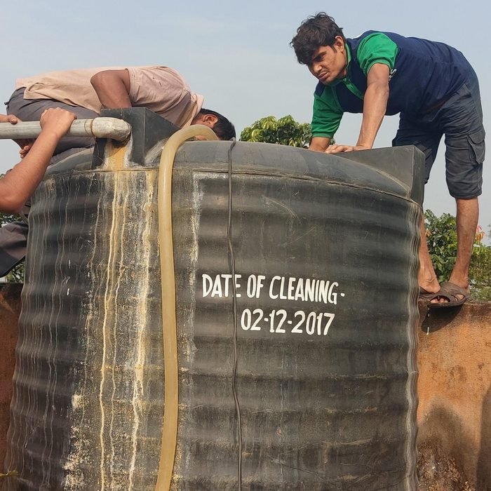 Overhead water tank on an independent home rooftop in Kolkata