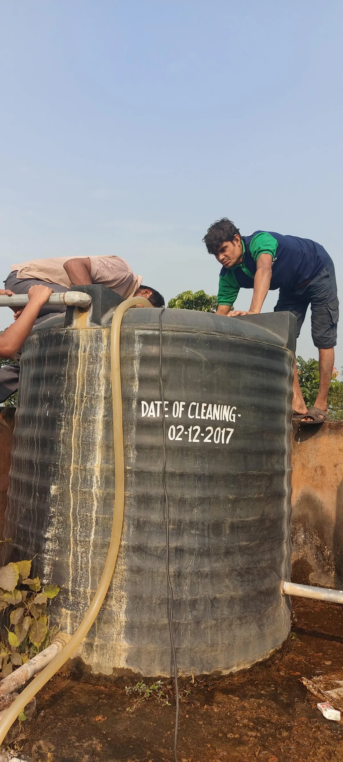 A cleaned water tank marked with its cleaning date by the SRS team